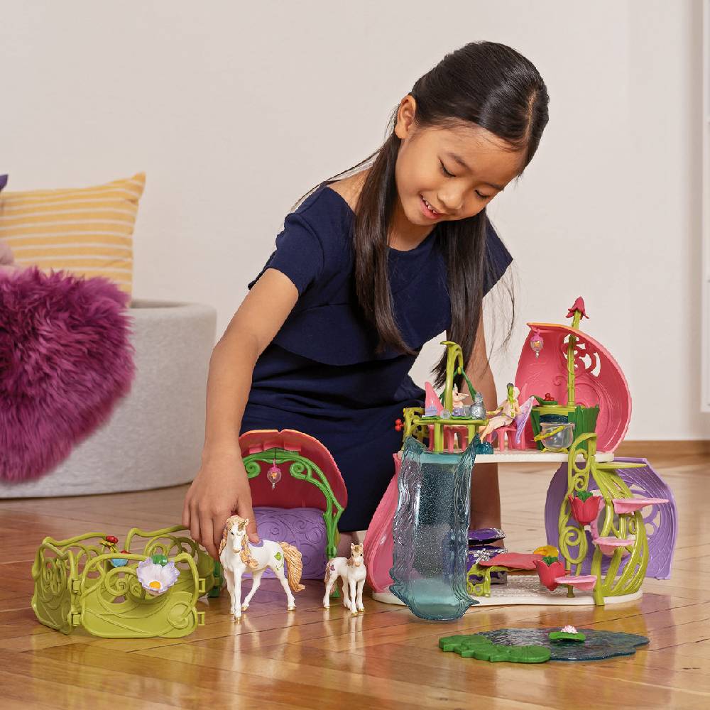 Schleich Glitzerndes Blütenhaus mit Einhörnern, See und Stall Angebote